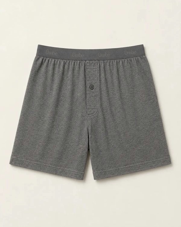 A charcoal cotton boxer short with a tonal jacquard waistband reading Ümbe.