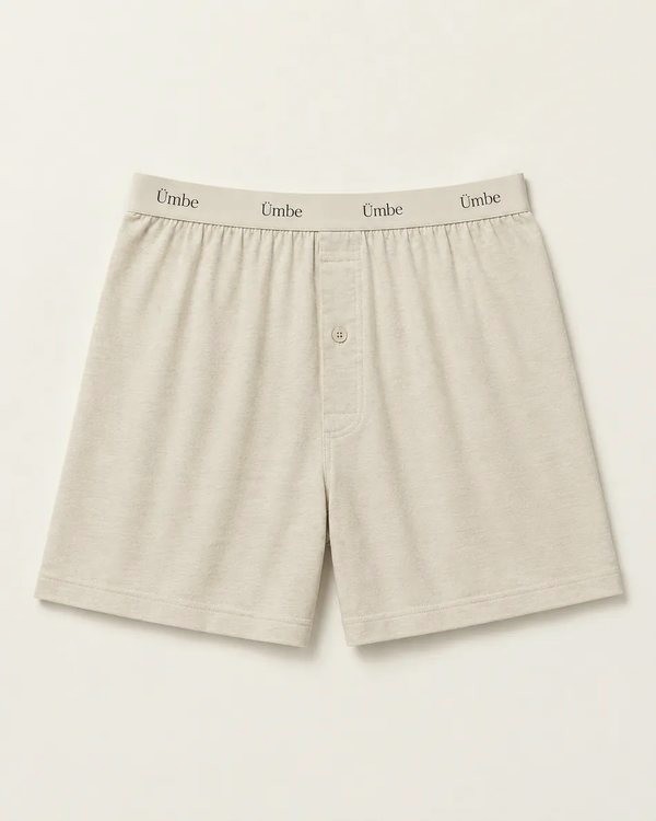 A cream cotton boxer short with a woven Ümbe waistband.