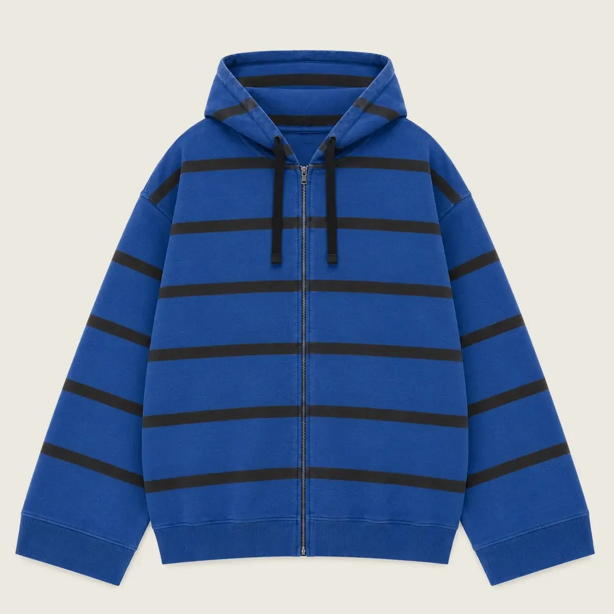 An oversized zip hoodie in cobalt blue with wide black stripes, from Ümbe Apparel.